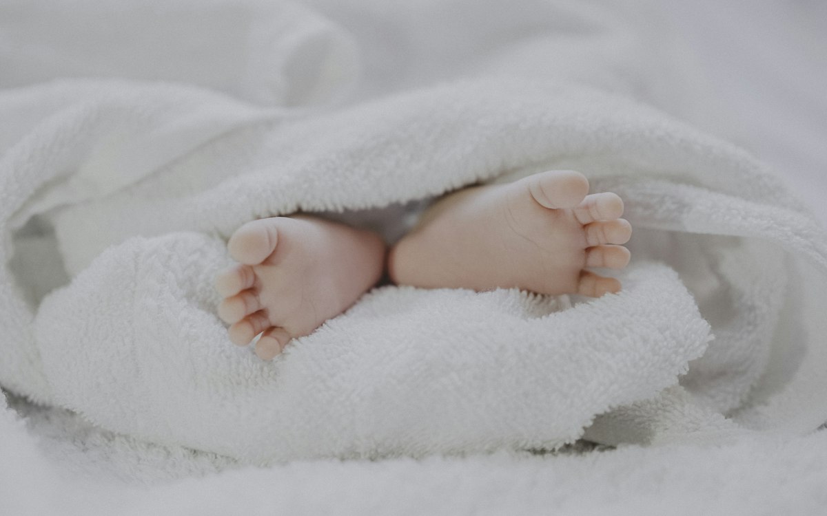 Sleeping baby in nursery monitored with a smart ambient video and movement tracking system